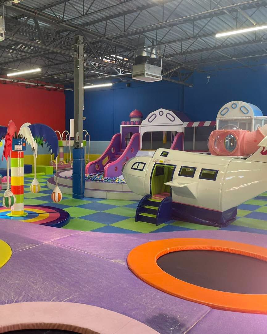 Airplane play structure with its purple slide