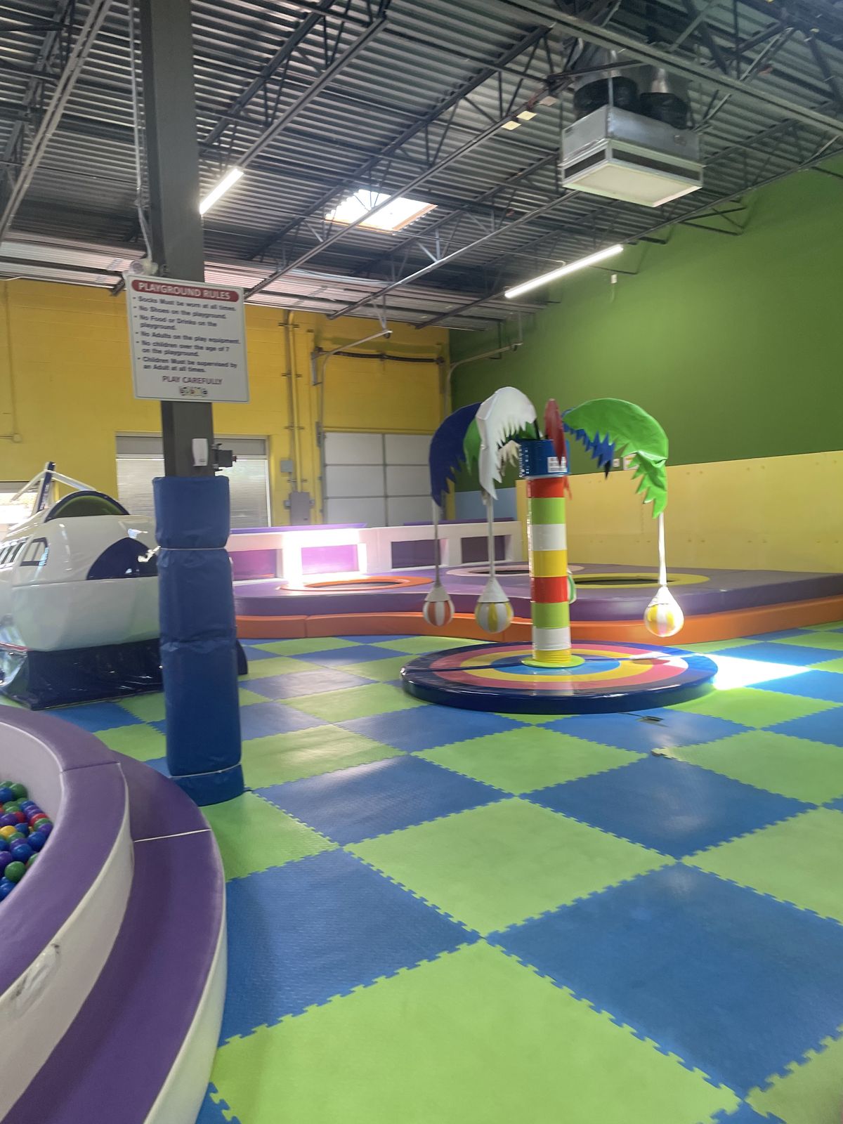 Ball pit, airplane and palm-tree play areas