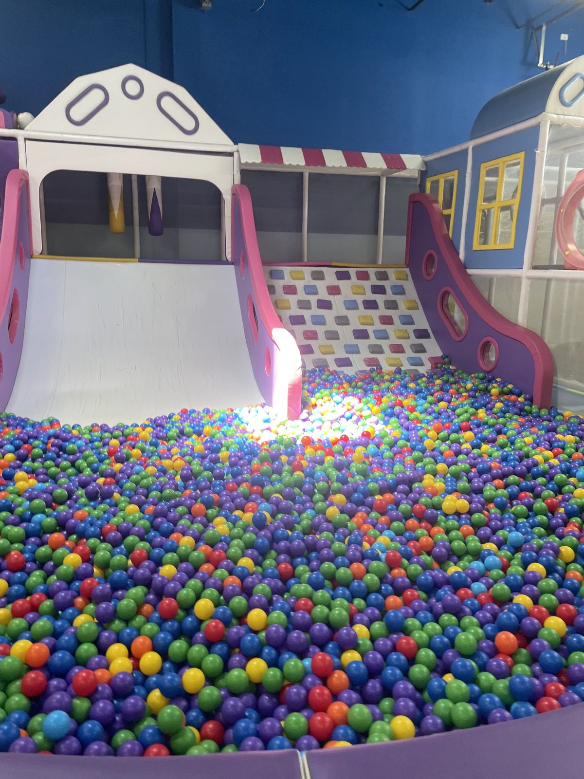 Two slides leading into the ball pit