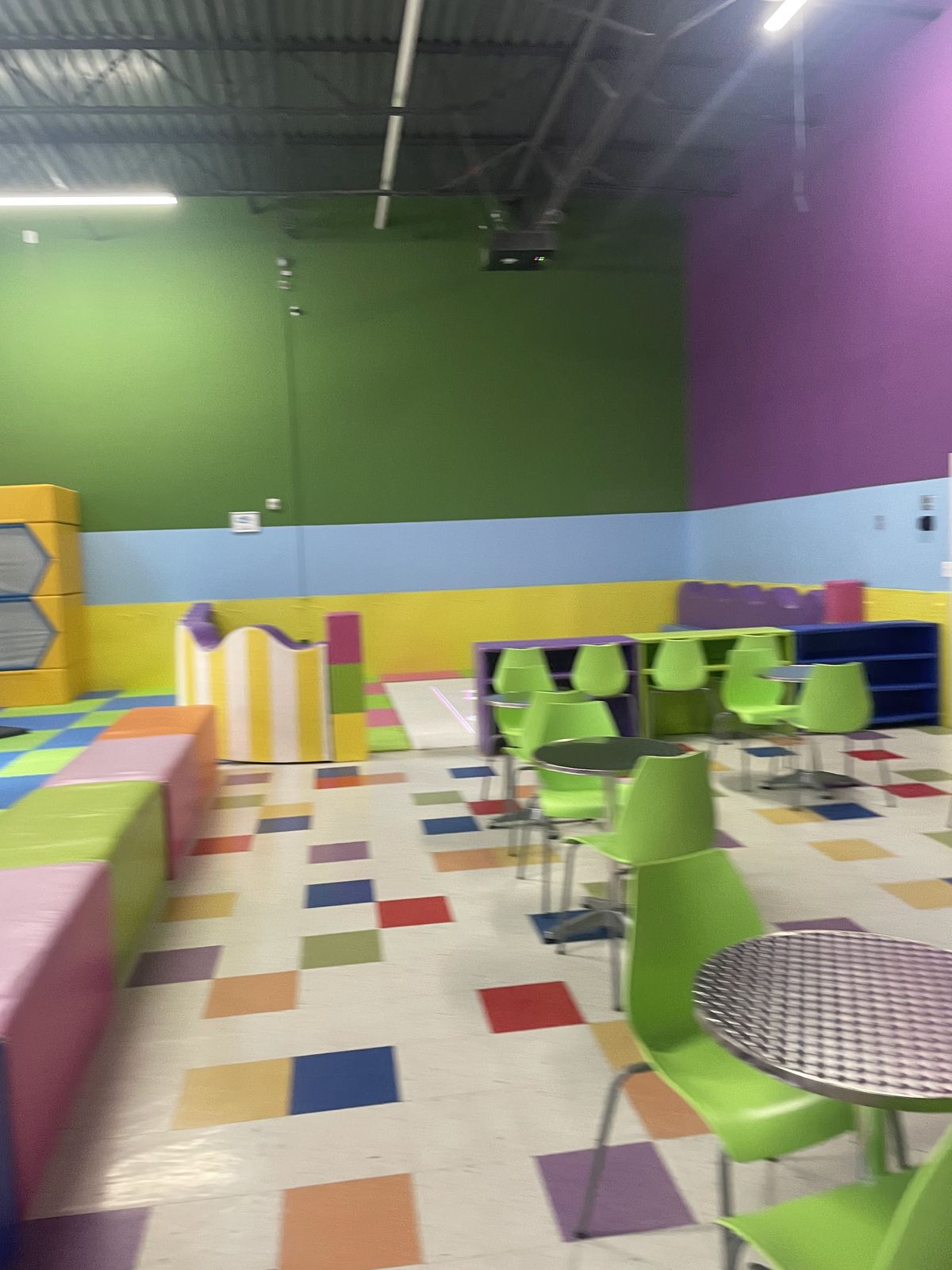 Soft-play area with child-sized seating