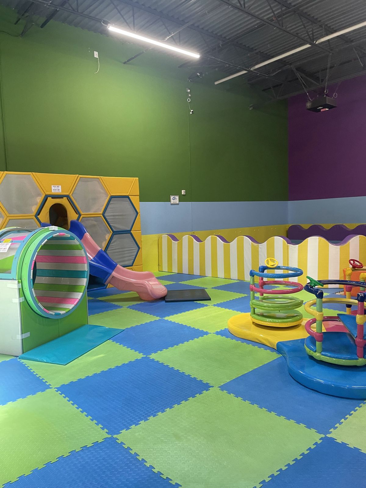 Colorful tunnel slide in the soft-play area