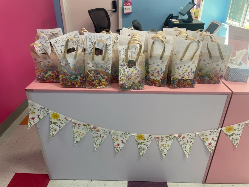 Party favor bags arranged on a decorated table