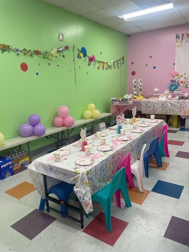 Pastel party tables with soft balloon garland