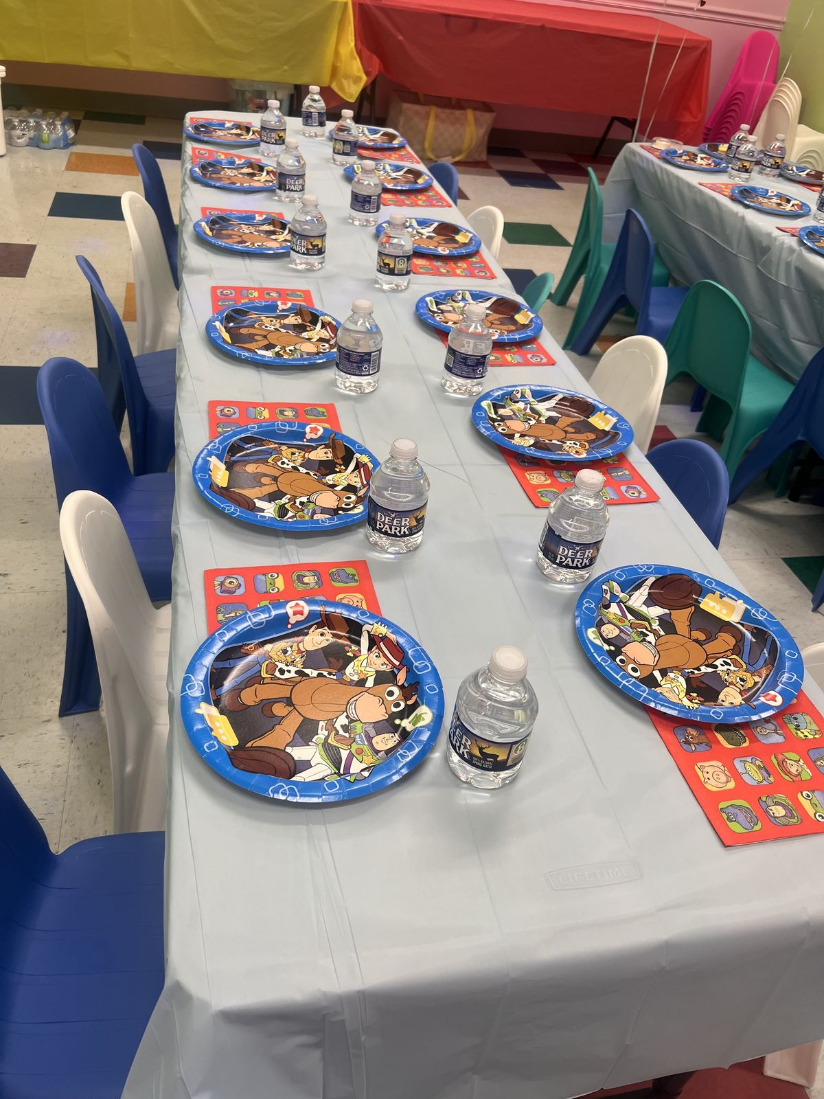 Toy Story party table with themed plates and favors